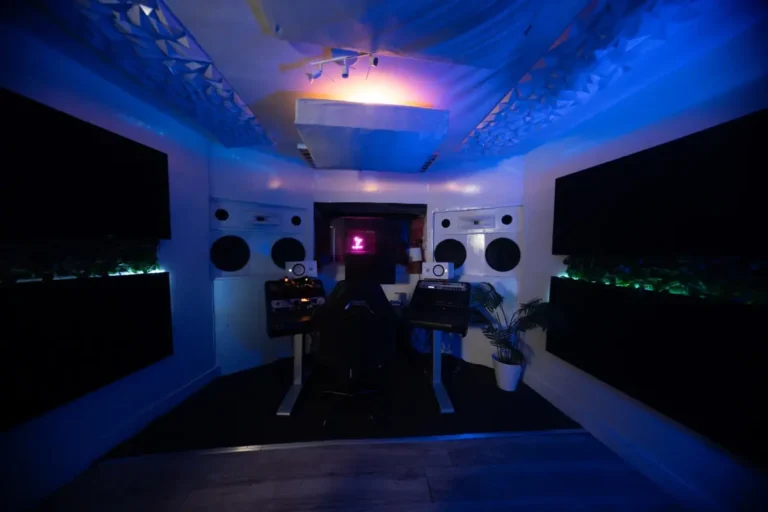 Tracking room at Ocean Blue Recording studio in Decatur, GA with studio monitors and blue LED lighting